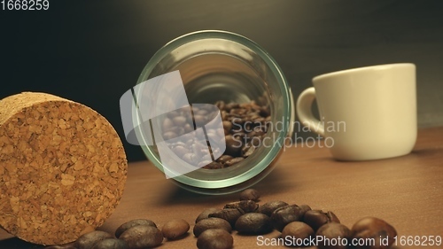 Image of Roasted coffee beans on table in camera motion