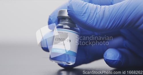 Image of Vaccine in human hands closeup footage