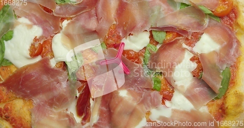 Image of Delicious pizza surface with chease and meat rotating