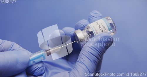 Image of Vaccine in human hands closeup footage