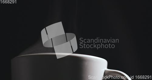 Image of Vapor rising from hot mug closeup footage