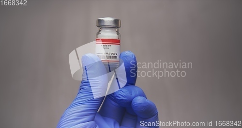 Image of Vaccine in human hands closeup footage