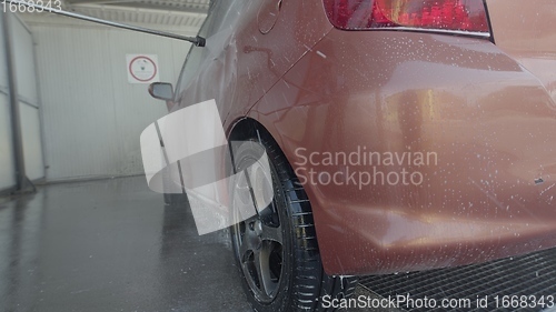 Image of Eashing dirty car closeup footage