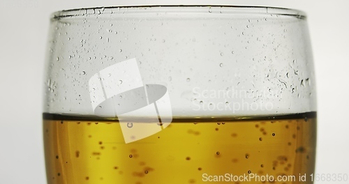 Image of Glass of beer on the table slow motion footage