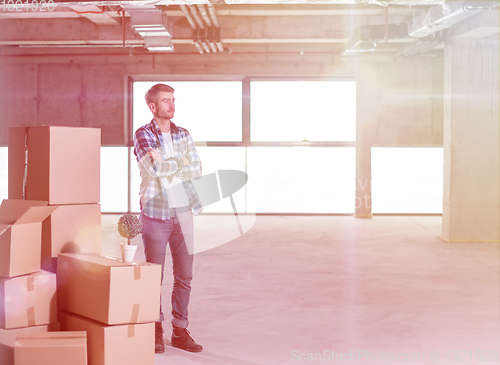 Image of portrait of young businessman on construction site