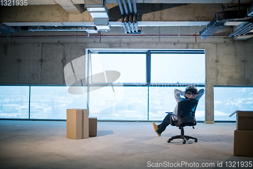 Image of young business man taking a break on construction site