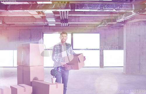 Image of portrait of young businessman on construction site