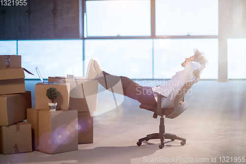 Image of young business man taking a break on construction site