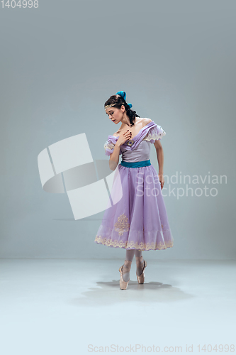 Image of Contemporary ballroom dancer on grey studio background