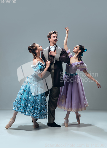 Image of Contemporary ballroom dancers on grey studio background