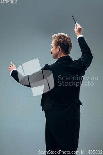 Image of Contemporary ballroom dancer on grey studio background