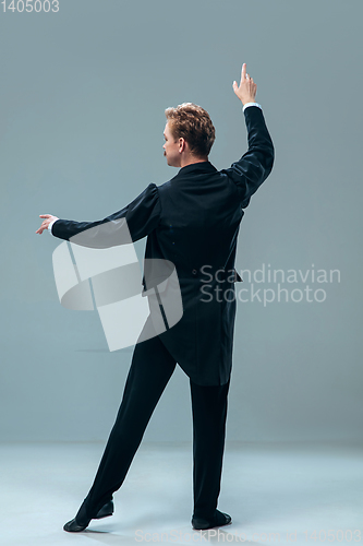 Image of Contemporary ballroom dancer on grey studio background