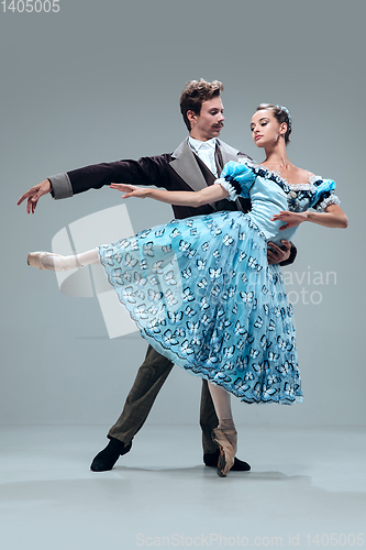 Image of Contemporary ballroom dancers on grey studio background