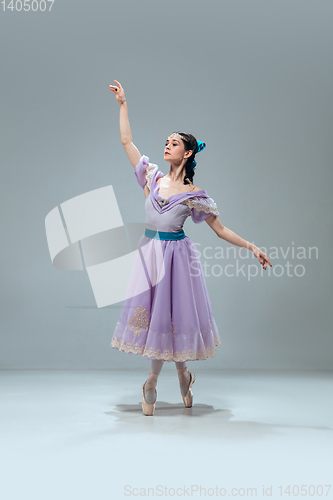 Image of Contemporary ballroom dancer on grey studio background