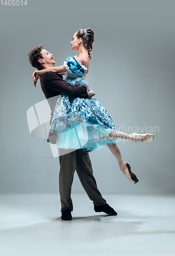Image of Contemporary ballroom dancers on grey studio background