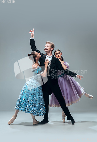 Image of Contemporary ballroom dancers on grey studio background