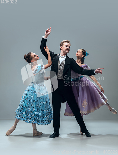 Image of Contemporary ballroom dancers on grey studio background