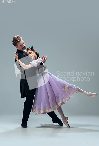 Image of Contemporary ballroom dancers on grey studio background