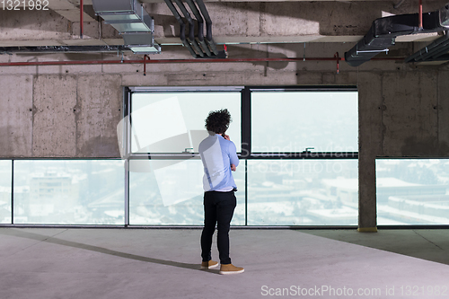 Image of portrait of young male architect on construction site