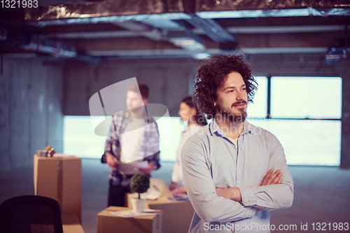 Image of young businessman on construction site