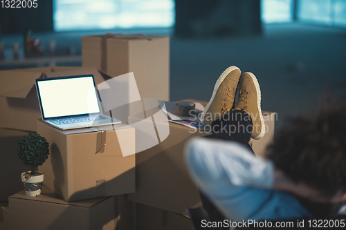 Image of young business man taking a break on construction site