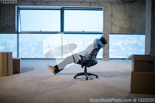 Image of young business man taking a break on construction site