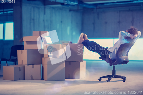 Image of young business man taking a break on construction site