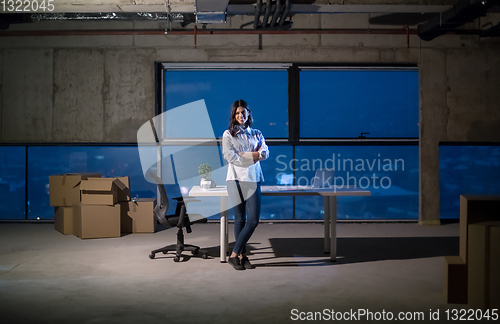 Image of young female architect and engineer on construction site