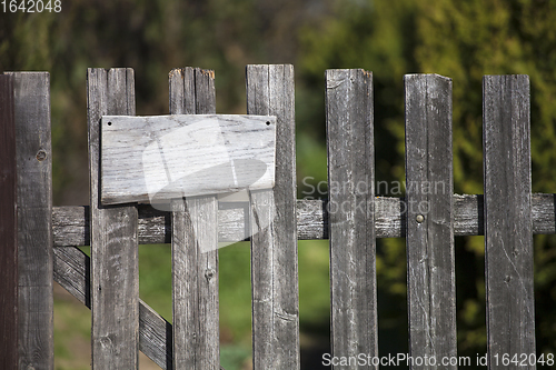 Image of Wooden fence with empty sign board