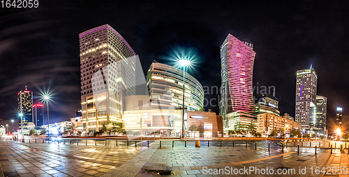 Image of Night skyline of Warsaw with soviet era and modern skyscrapers. 