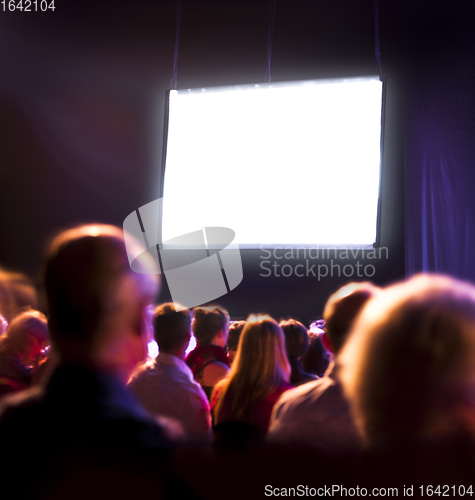 Image of Crowd audience looking at screen