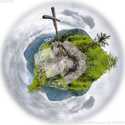 Image of Wooden cross on mountain peak. Tiny planet