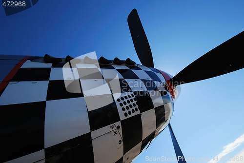 Image of A checkered veteran plane.