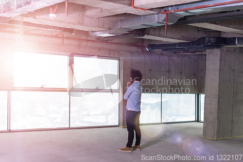 Image of portrait of young male architect on construction site