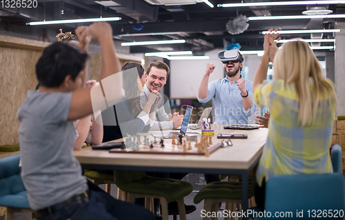 Image of Young Multiethnic Business team using virtual reality headset