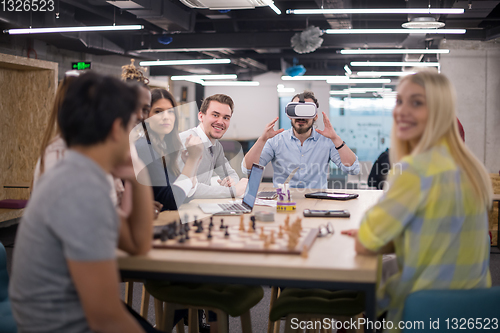 Image of Young Multiethnic Business team using virtual reality headset