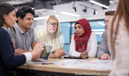 Image of Multiethnic startup business team having meeting