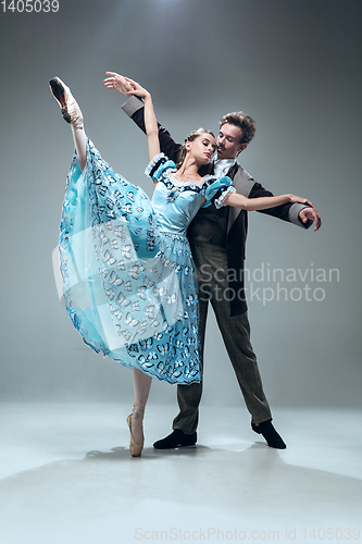 Image of Contemporary ballroom dancers on grey studio background