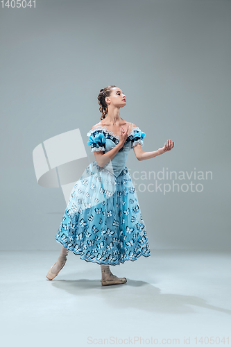 Image of Contemporary ballroom dancer on grey studio background