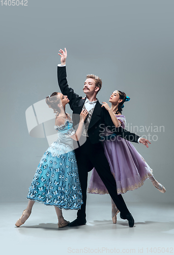 Image of Contemporary ballroom dancers on grey studio background