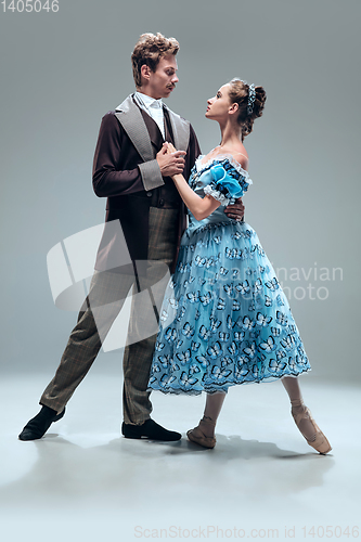 Image of Contemporary ballroom dancers on grey studio background