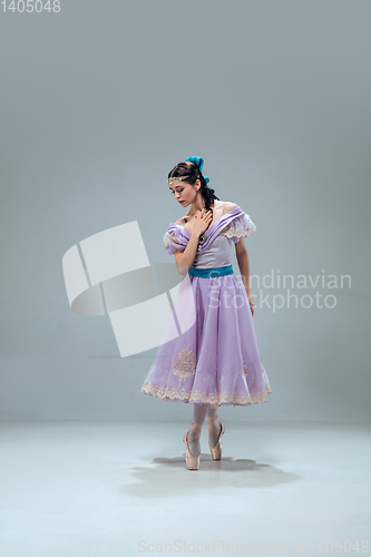 Image of Contemporary ballroom dancer on grey studio background