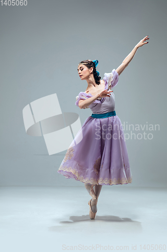 Image of Contemporary ballroom dancer on grey studio background