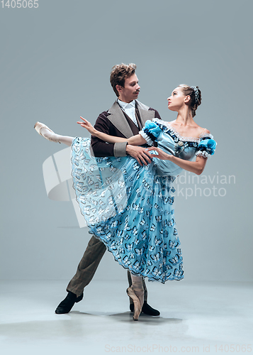 Image of Contemporary ballroom dancers on grey studio background