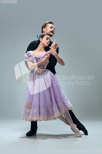 Image of Contemporary ballroom dancers on grey studio background