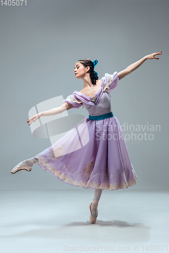 Image of Contemporary ballroom dancer on grey studio background