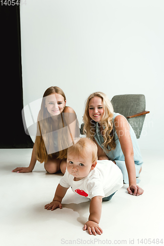 Image of Young family spending time together and smiling