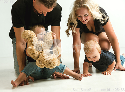 Image of Young family spending time together and smiling