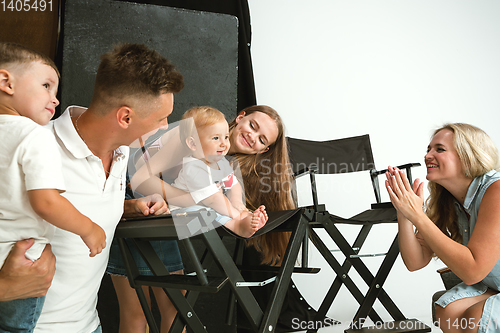 Image of Young family spending time together and smiling