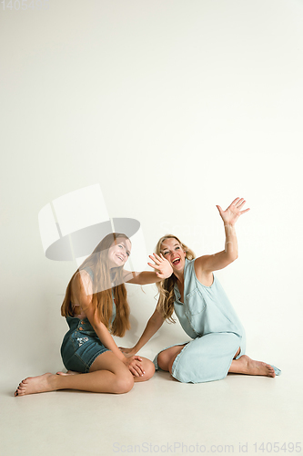 Image of Mom spending time with her daughter and smiling